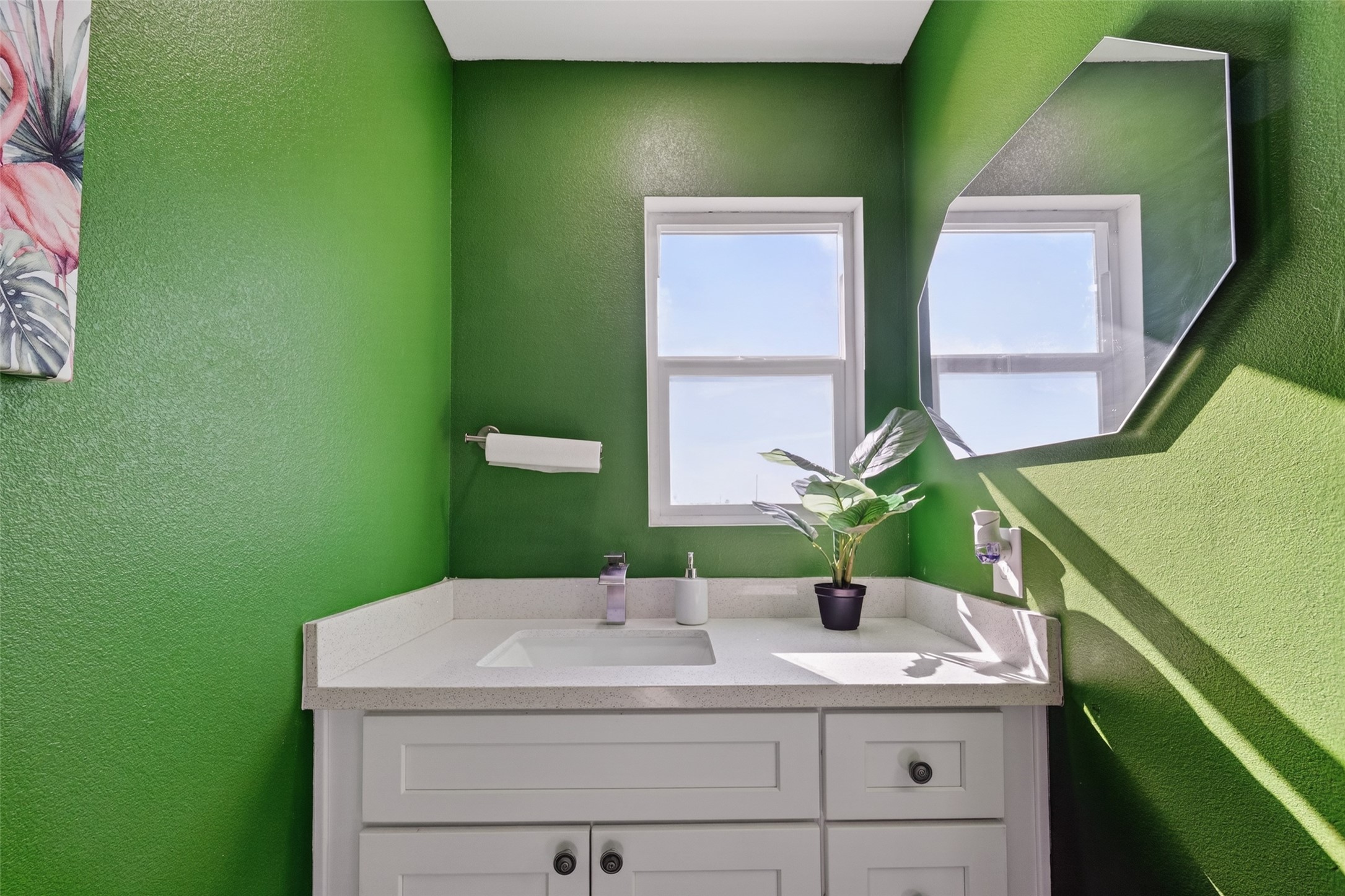 154 Poop Deck Lane Freeport, TX 77541 - Photo 19 of 32 a bathroom with a sink and a mirror