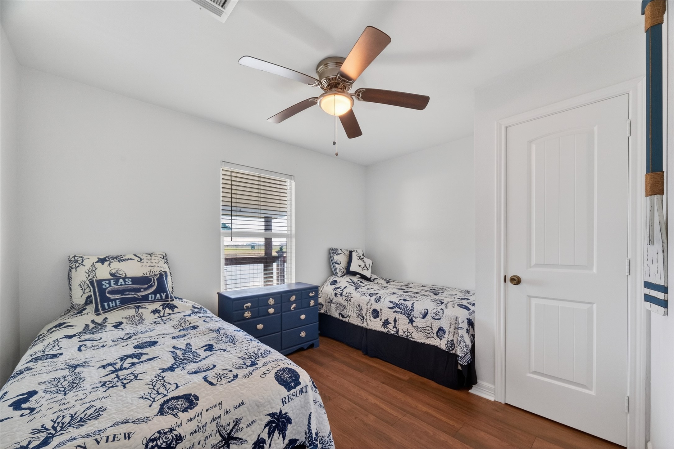 154 Poop Deck Lane Freeport, TX 77541 - Photo 21 of 32 a bedroom with a bed and a window