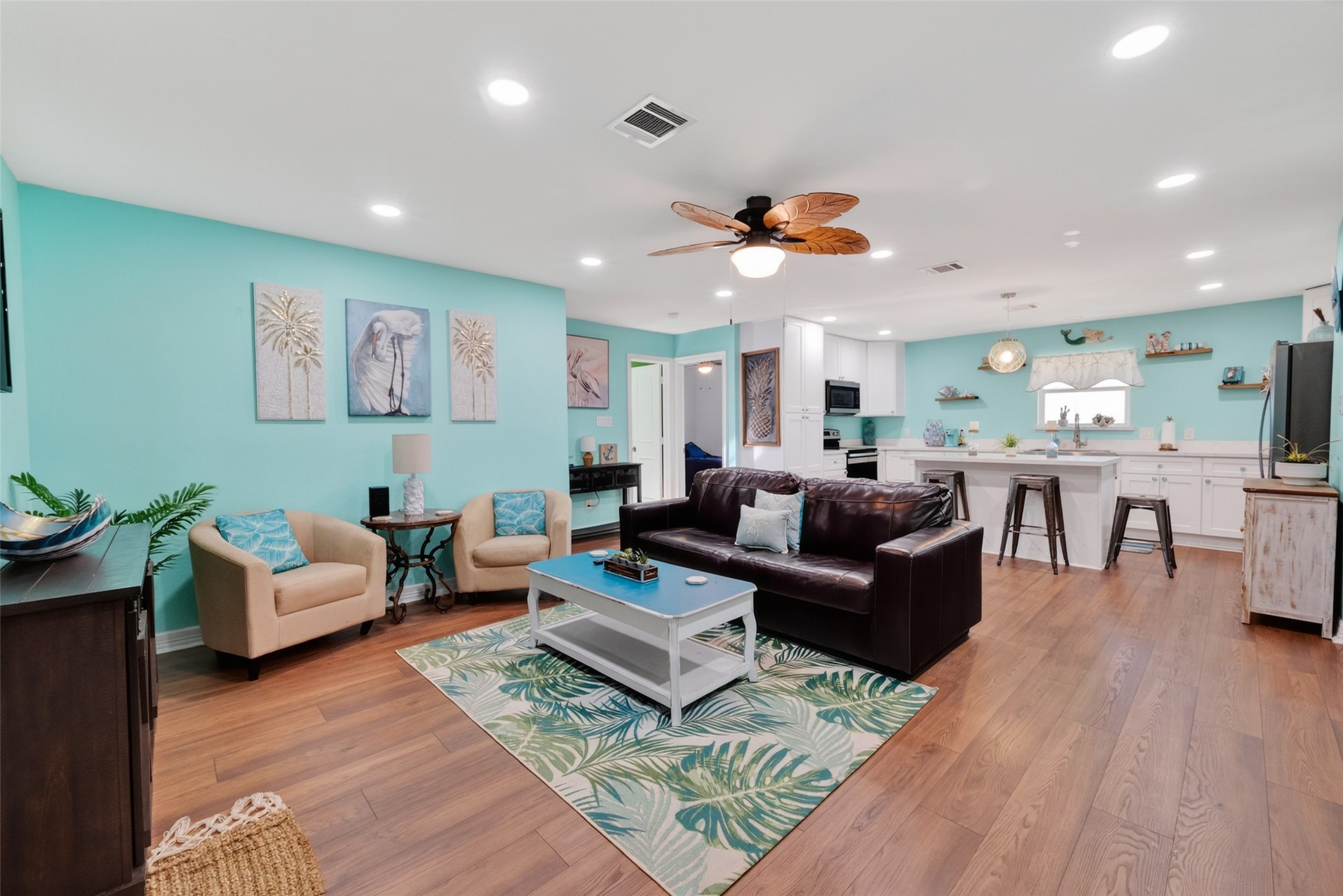 154 Poop Deck Lane Freeport, TX 77541 - Photo 31 of 32 a living room with furniture kitchen view and a chandelier