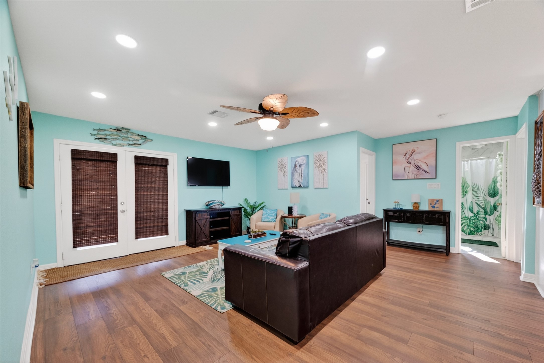 154 Poop Deck Lane Freeport, TX 77541 - Photo 32 of 32 a living room with furniture flat screen tv and a fireplace