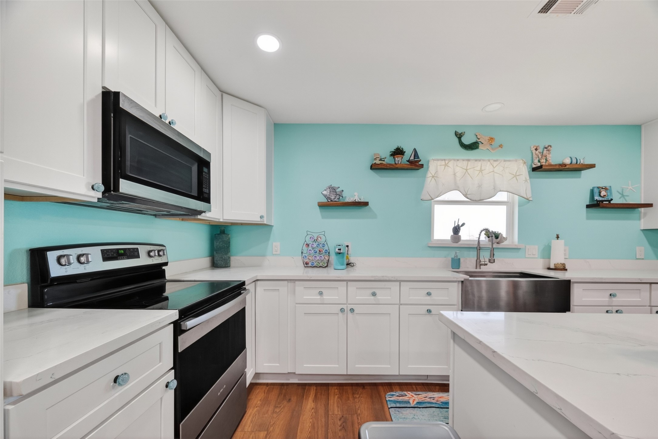 154 Poop Deck Lane Freeport, TX 77541 - Photo 8 of 32 a kitchen with a sink a stove and cabinets