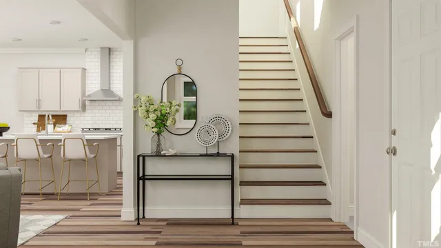 a view of entryway and hall with wooden floor