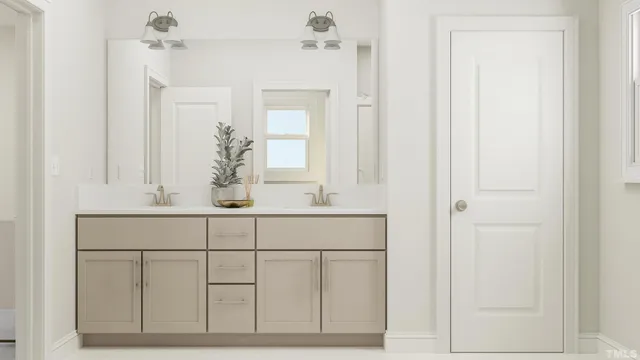 a bathroom with a sink vanity and mirror