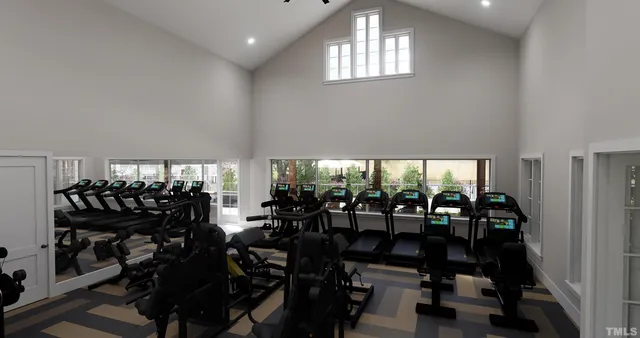 a room with lots of wooden furniture and windows