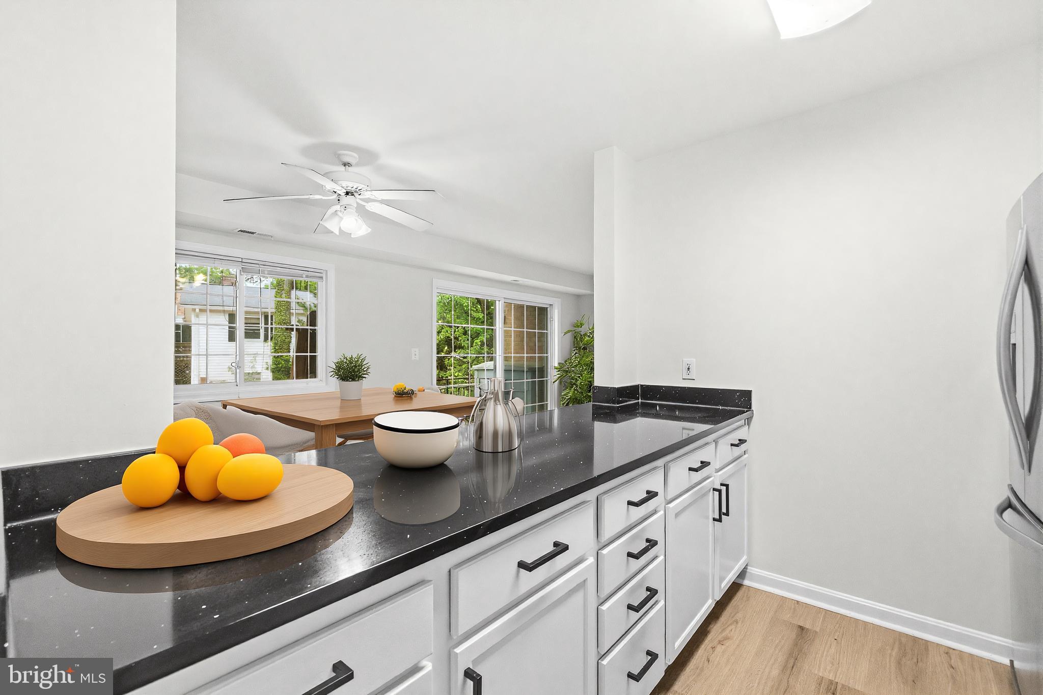 635 Waterloo Road, Unit 222 Warrenton, VA 20186 - Photo 12 of 28 a kitchen with a sink and wooden floor