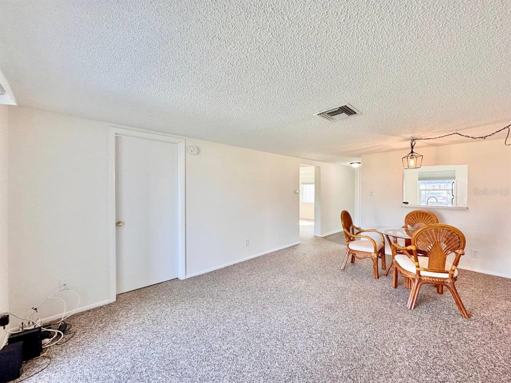 3422 Trophy Boulevard New Port Richey, FL 34655 - Photo 4 of 21 a living room with furniture and a window