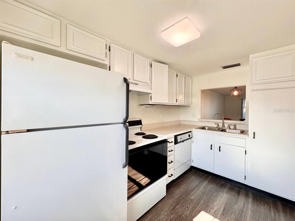 3422 Trophy Boulevard New Port Richey, FL 34655 - Photo 7 of 21 a white refrigerator freezer sitting inside of a kitchen