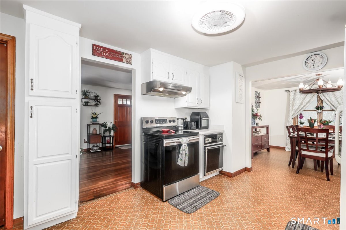 306 Welton Street Hamden, CT 06517 - Photo 10 of 38 a kitchen with cabinets and stainless steel appliances