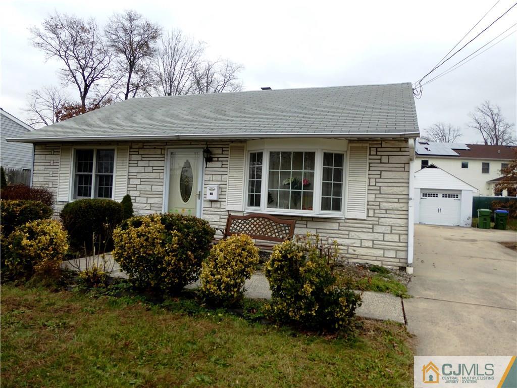 38 Crescent Road Edison, NJ 08817 - Photo 1 of 18 a front view of a house with a garden