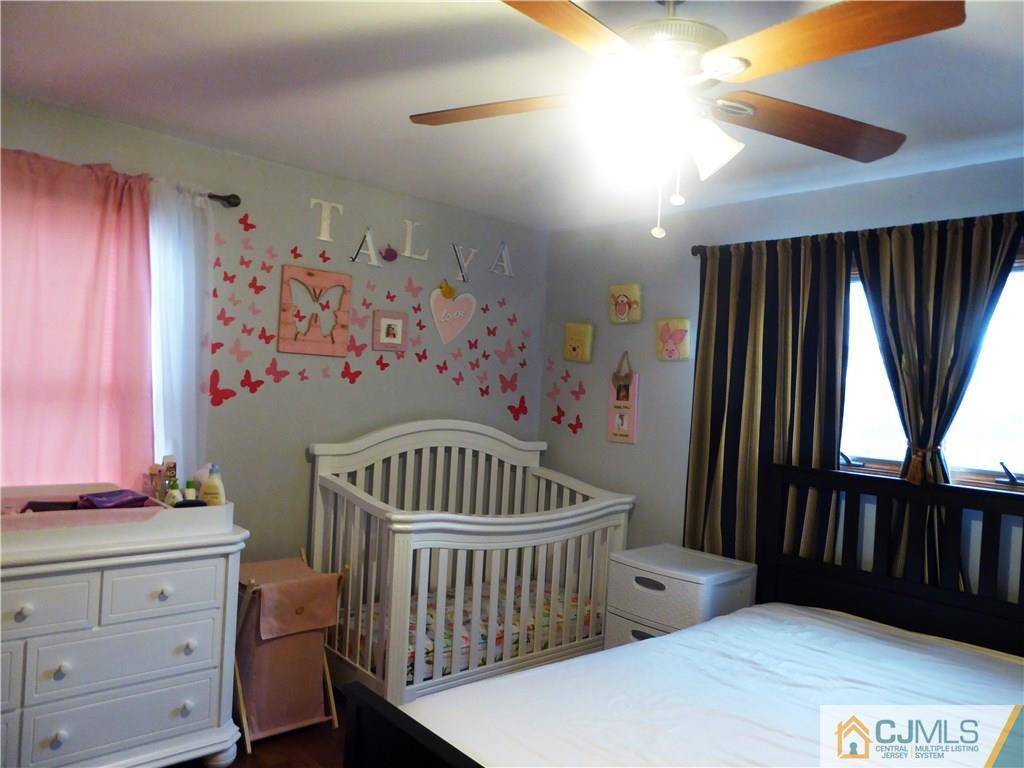 38 Crescent Road Edison, NJ 08817 - Photo 12 of 18 a bedroom with furniture and a window