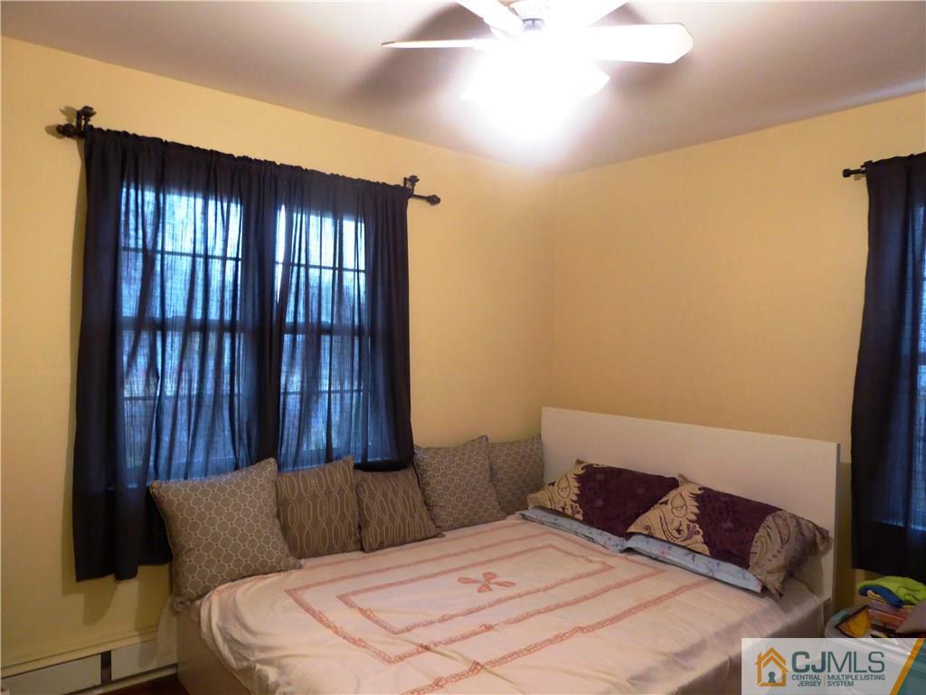 38 Crescent Road Edison, NJ 08817 - Photo 14 of 18 a bedroom with a bed and a window