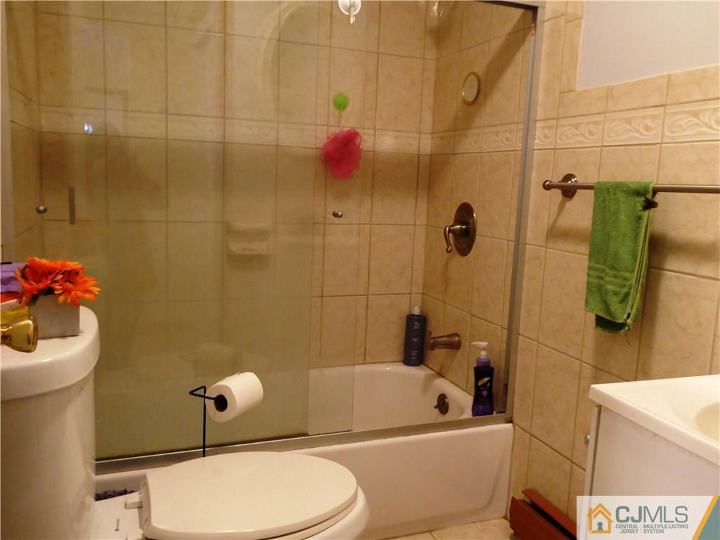 38 Crescent Road Edison, NJ 08817 - Photo 16 of 18 a bathroom with a sink toilet and shower