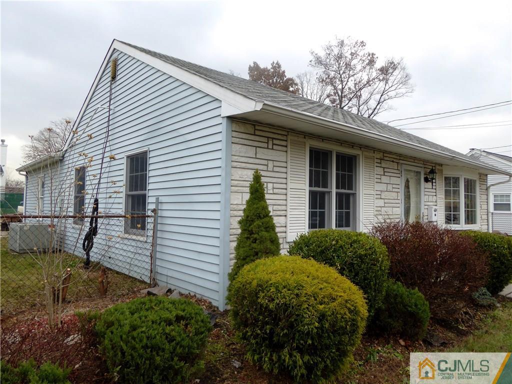 38 Crescent Road Edison, NJ 08817 - Photo 17 of 18 a view of a house with a small yard and plants