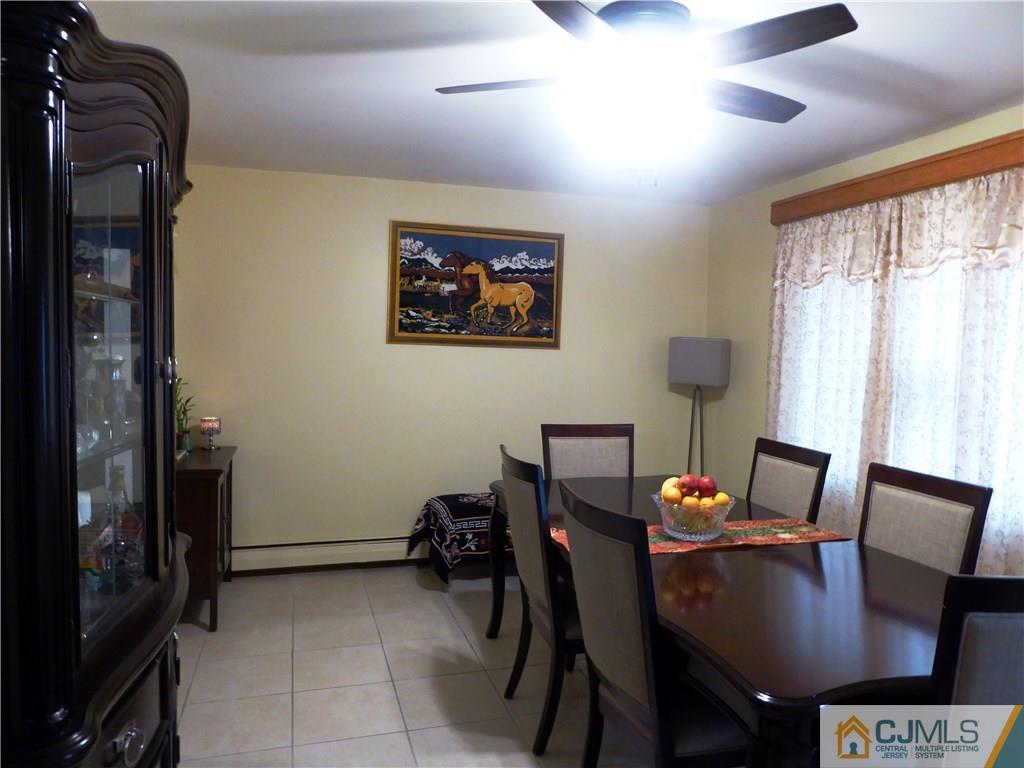 38 Crescent Road Edison, NJ 08817 - Photo 6 of 18 a view of a dining room with furniture and window