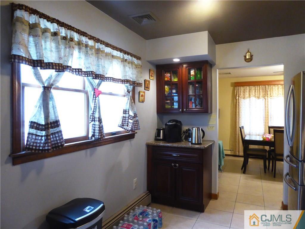 38 Crescent Road Edison, NJ 08817 - Photo 10 of 18 a kitchen with stainless steel appliances granite countertop a refrigerator and a stove