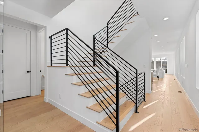 a bedroom with a large bed and a large window