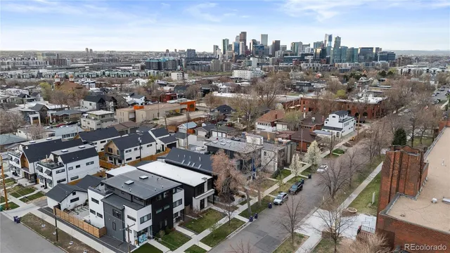 an aerial view of a city with lots of residential buildings