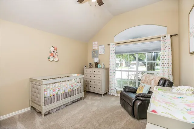 a bed room with furniture and a window