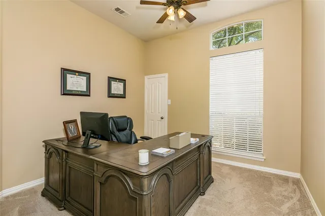 a view of a livingroom with furniture and a window