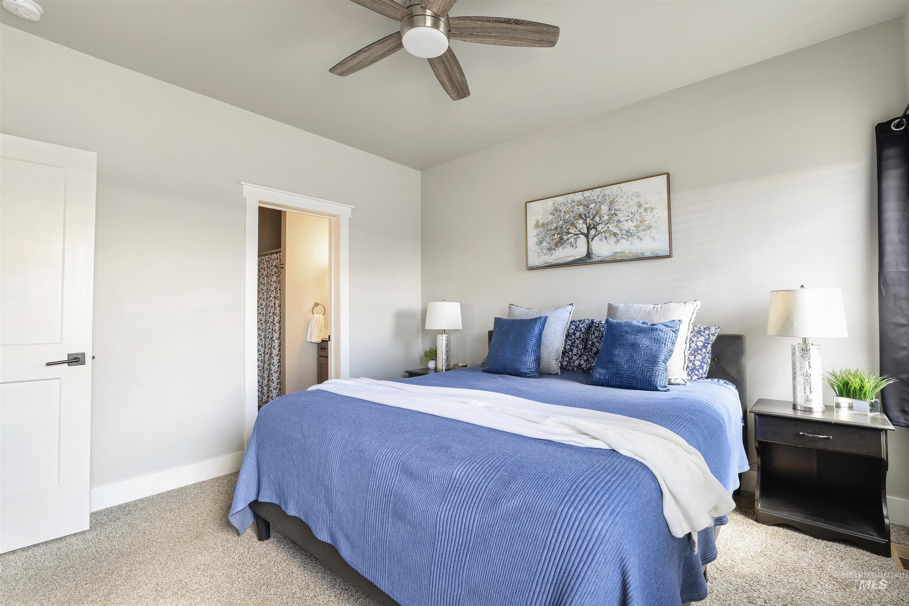 893-899 Shadowleaf Avenue Twin Falls, ID 83301 - Photo 11 of 50 Carpeted bedroom with ensuite bathroom and ceiling fan