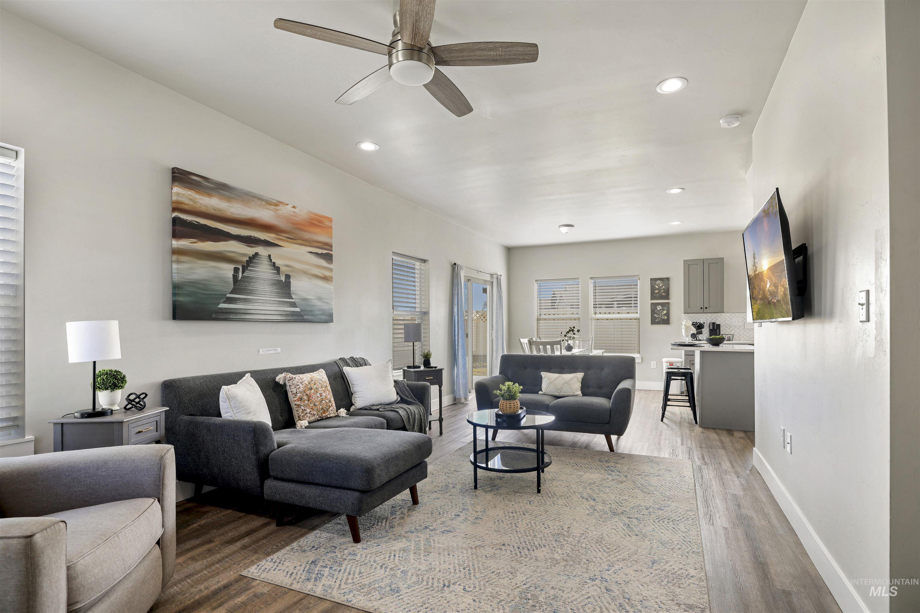893-899 Shadowleaf Avenue Twin Falls, ID 83301 - Photo 18 of 50 Living room featuring ceiling fan, wood finished floors, and recessed lighting