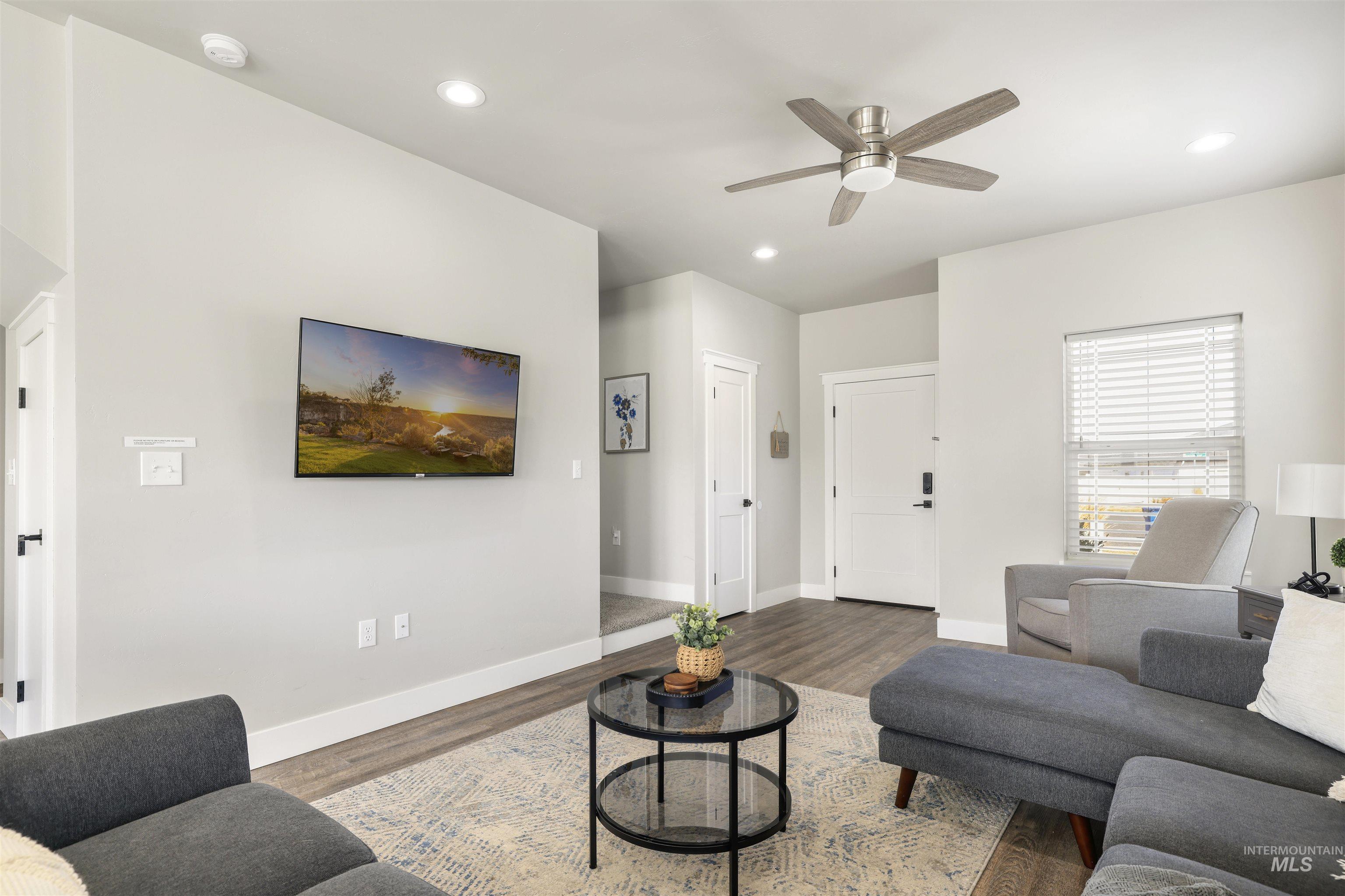 893-899 Shadowleaf Avenue Twin Falls, ID 83301 - Photo 20 of 50 Living room featuring ceiling fan, wood finished floors, and recessed lighting