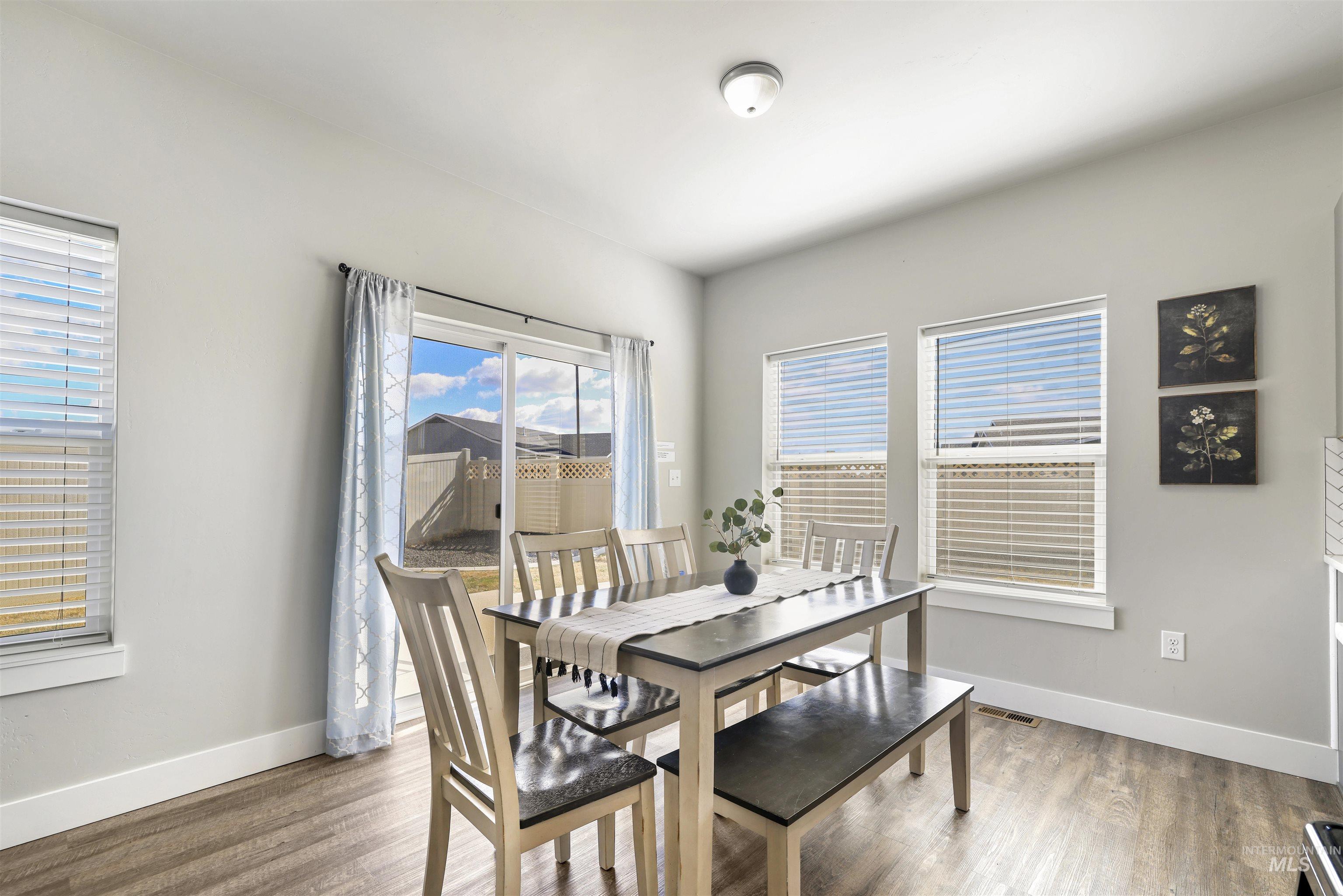 893-899 Shadowleaf Avenue Twin Falls, ID 83301 - Photo 21 of 50 Dining space with wood finished floors and baseboards