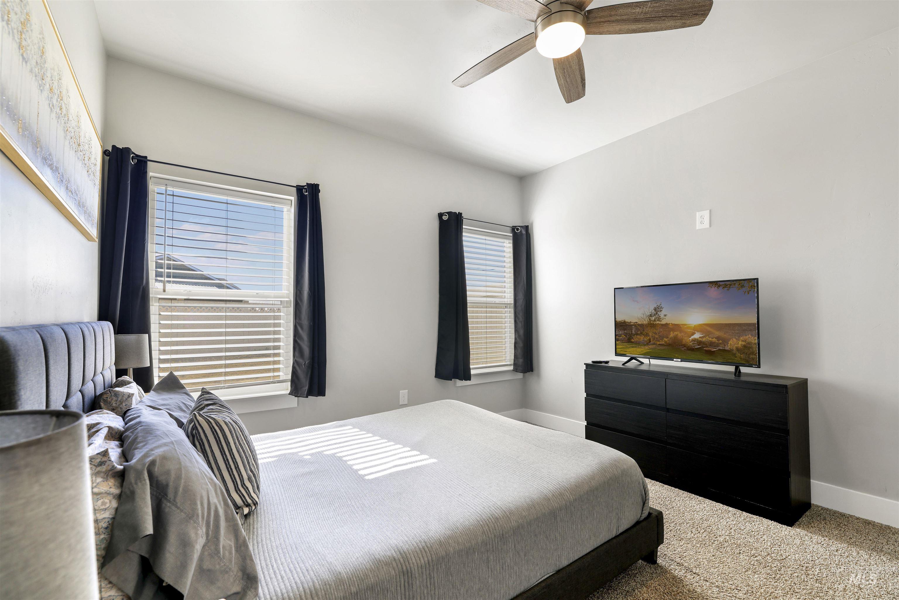 893-899 Shadowleaf Avenue Twin Falls, ID 83301 - Photo 27 of 50 Bedroom with carpet floors and a ceiling fan