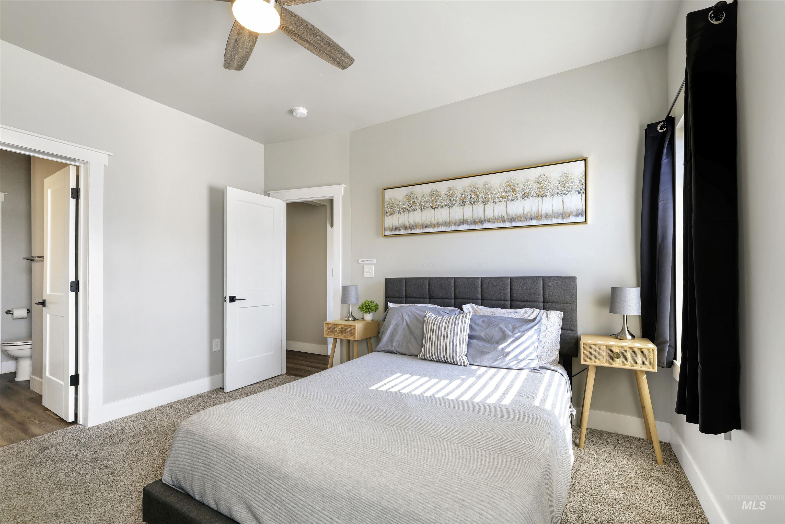 893-899 Shadowleaf Avenue Twin Falls, ID 83301 - Photo 29 of 50 Bedroom featuring carpet floors, ceiling fan, and ensuite bathroom