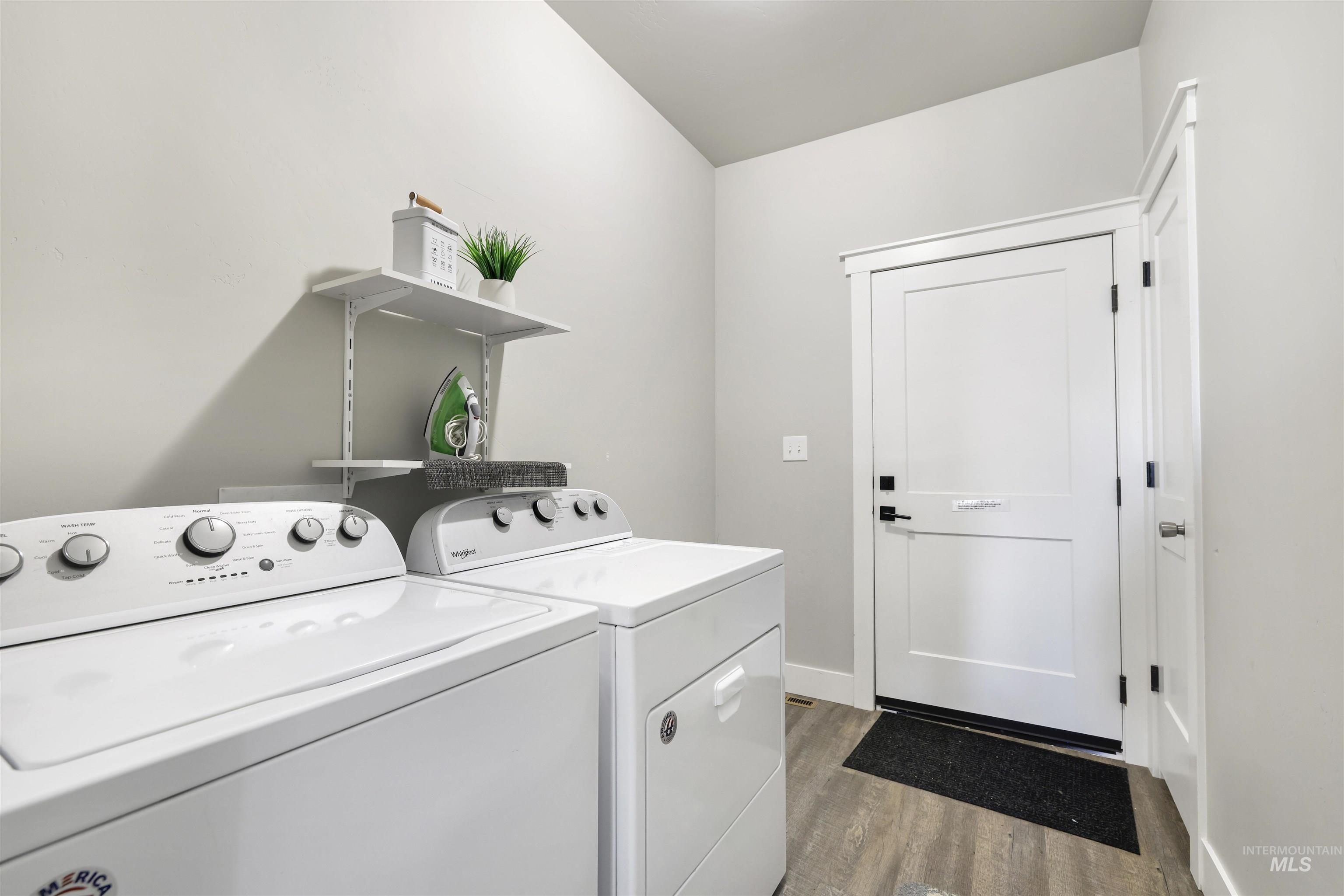 893-899 Shadowleaf Avenue Twin Falls, ID 83301 - Photo 31 of 50 Laundry area with light wood-style floors and washing machine and dryer
