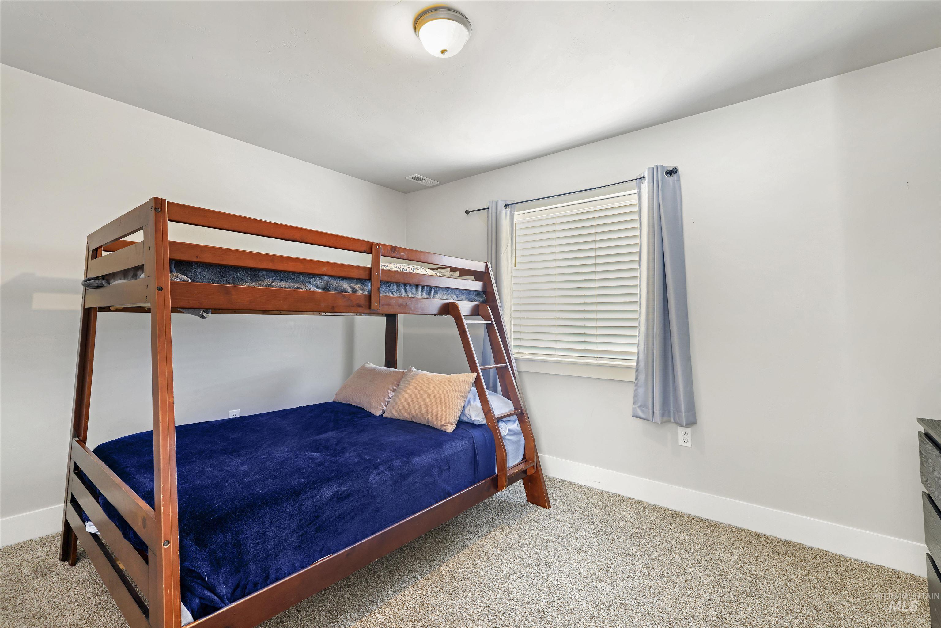 893-899 Shadowleaf Avenue Twin Falls, ID 83301 - Photo 32 of 50 Bedroom featuring light carpet and baseboards