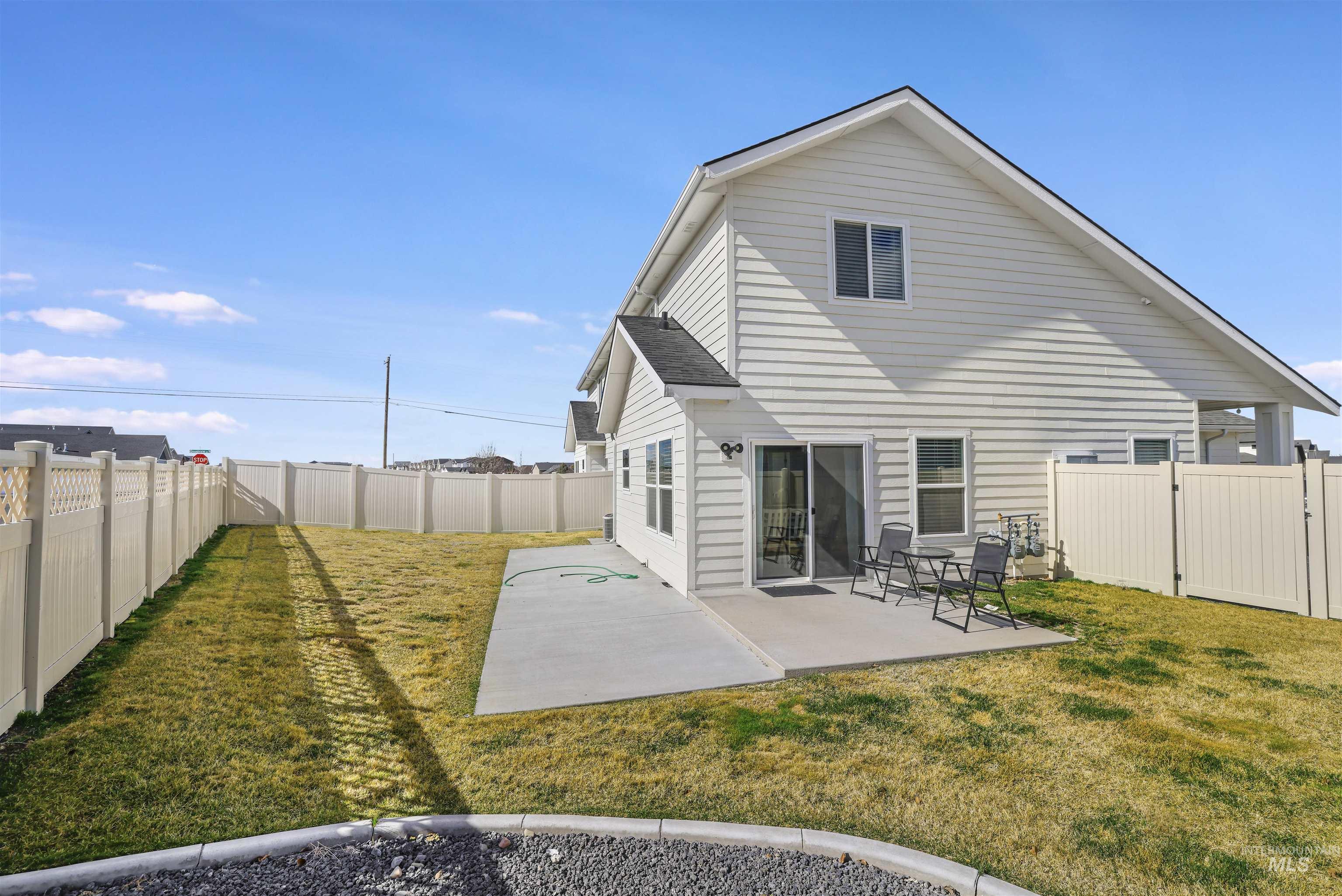 893-899 Shadowleaf Avenue Twin Falls, ID 83301 - Photo 36 of 50 Back of property featuring a fenced backyard and a patio area