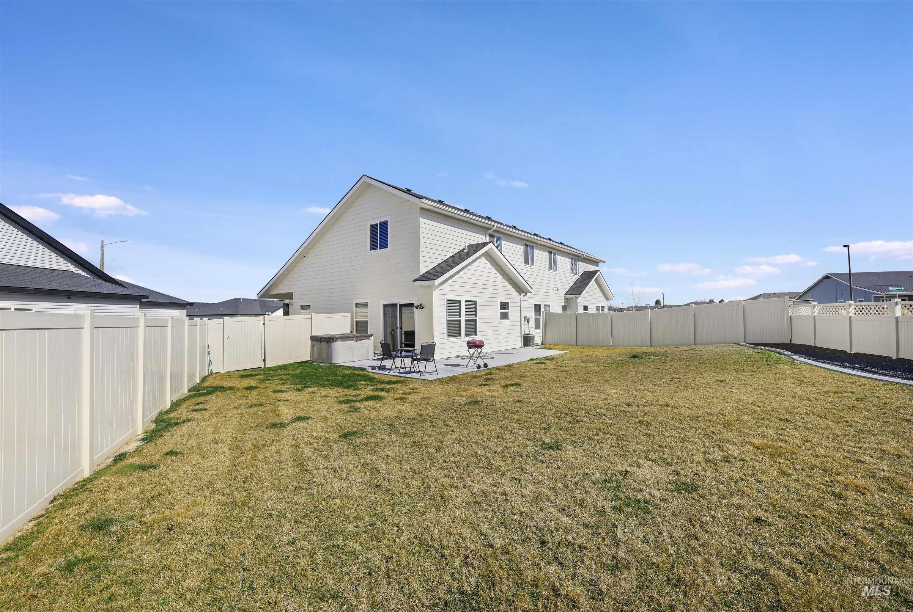 893-899 Shadowleaf Avenue Twin Falls, ID 83301 - Photo 38 of 50 Back of house featuring a patio and a fenced backyard