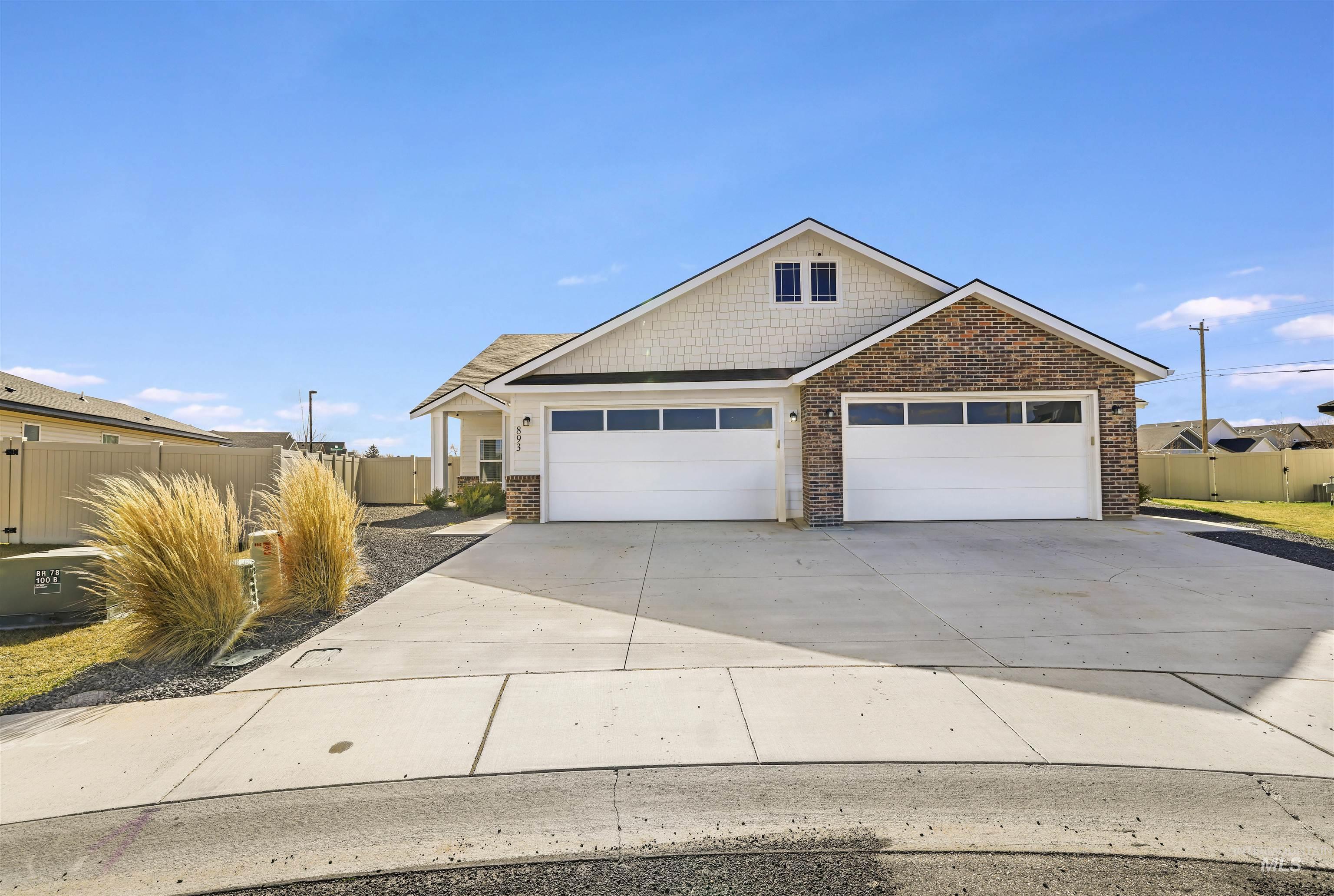 893-899 Shadowleaf Avenue Twin Falls, ID 83301 - Photo 40 of 50 View of front of property with concrete driveway, a gate, and a garage