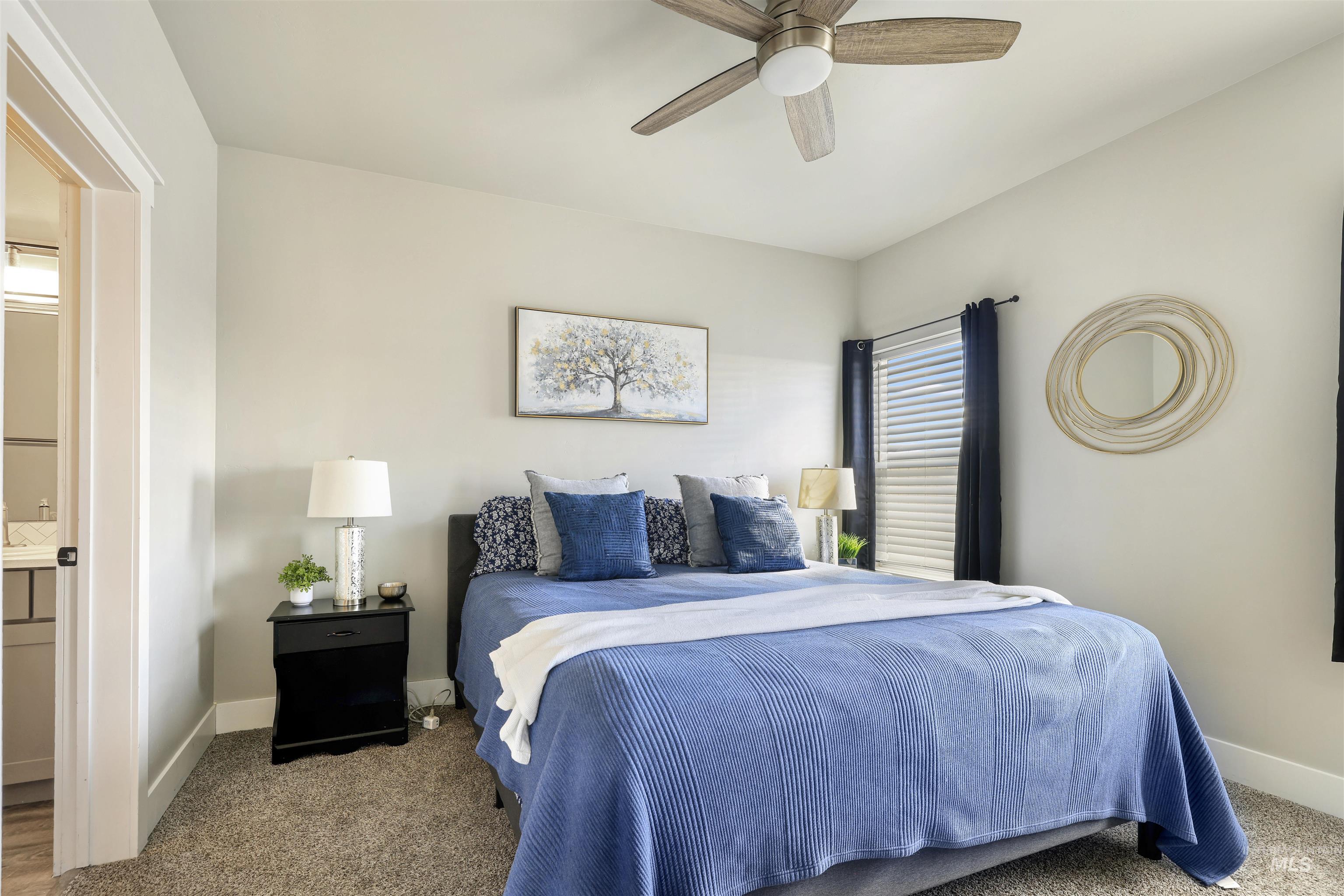 893-899 Shadowleaf Avenue Twin Falls, ID 83301 - Photo 10 of 50 Carpeted bedroom featuring ensuite bathroom and ceiling fan