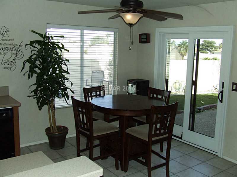 2168 Running River Road Henderson, NV 89074 - Photo 3 of 35 Kitchen. A comfortable dining nook in the kitchen enjoys peaceful views of the backyard and beyond!