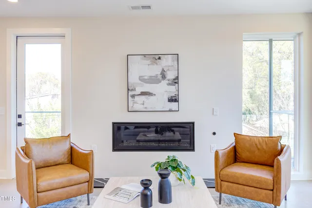 a en suite bathroom with a granite countertop sink and a mirror