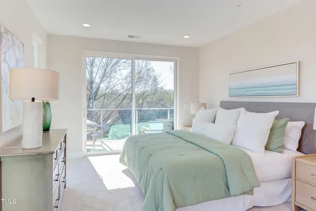 a balcony with furniture and a potted plant