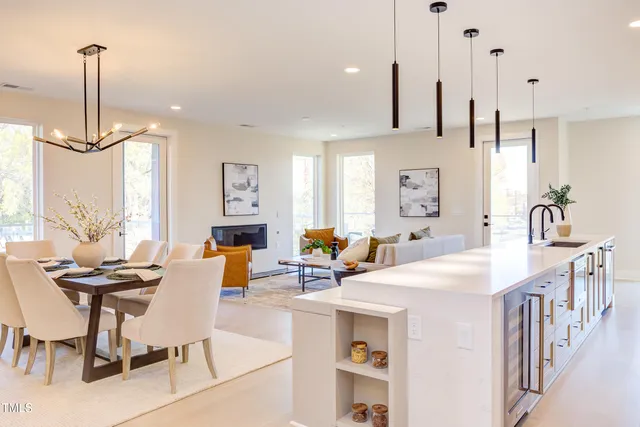 a room with painting and a potted plant