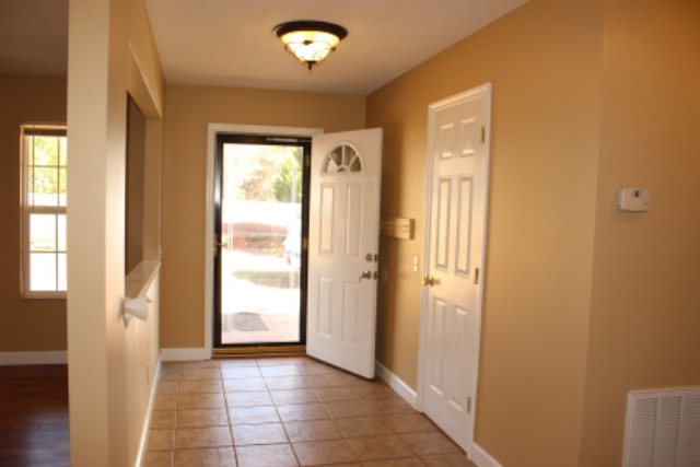 249 Callaway Road Forsyth, GA 31029 - Photo 2 of 13 a view of a hallway with wooden shelves