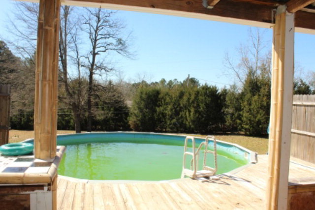 249 Callaway Road Forsyth, GA 31029 - Photo 13 of 13 a view of a swimming pool with a yard