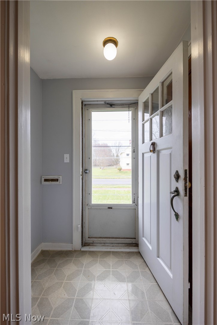 14474 Pease Road Maple Heights, OH 44137 - Photo 5 of 50 Doorway featuring light tile flooring