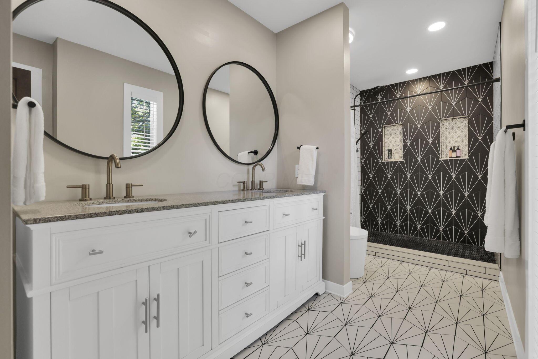 4390 Dublin Road Columbus, OH 43221 - Photo 49 of 83 Deluxe customized ceramic bath, oversized shower, double vanities & round mirrors.