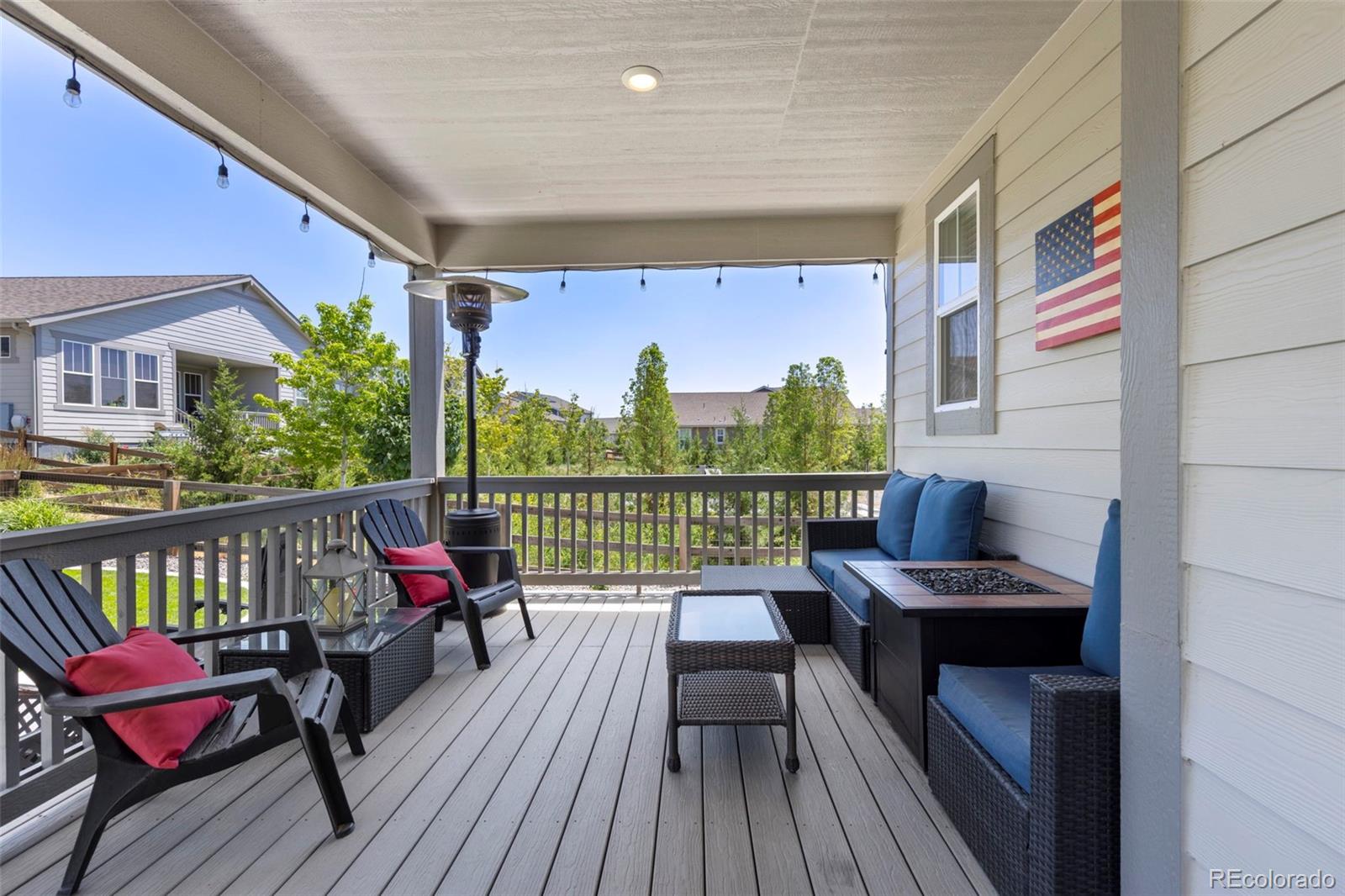 5067 Preserve Place Firestone, CO 80504 - Photo 11 of 50 a balcony with wooden floor table and chairs