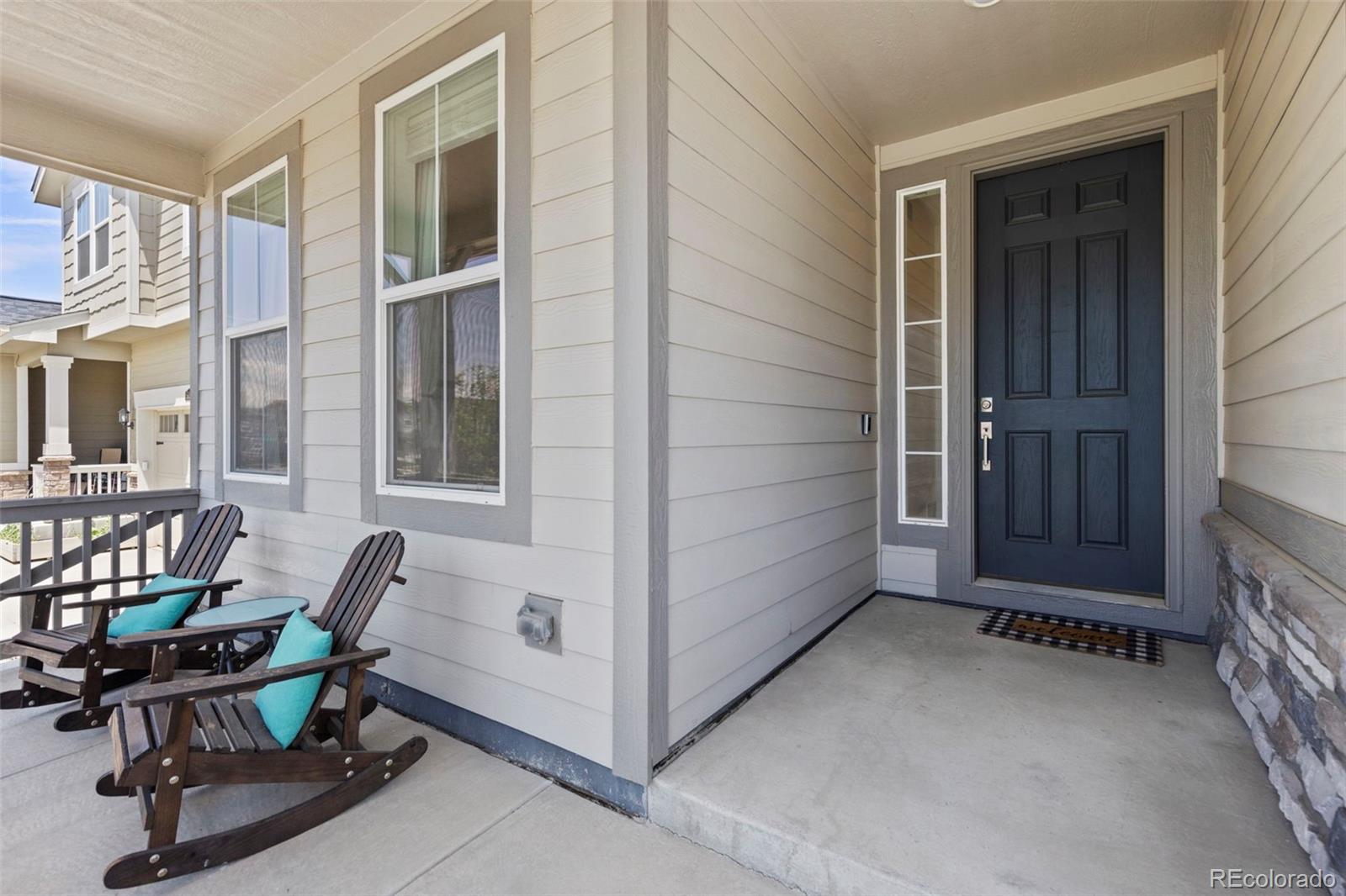 5067 Preserve Place Firestone, CO 80504 - Photo 14 of 50 a view of a room that has a couch and a chair in it
