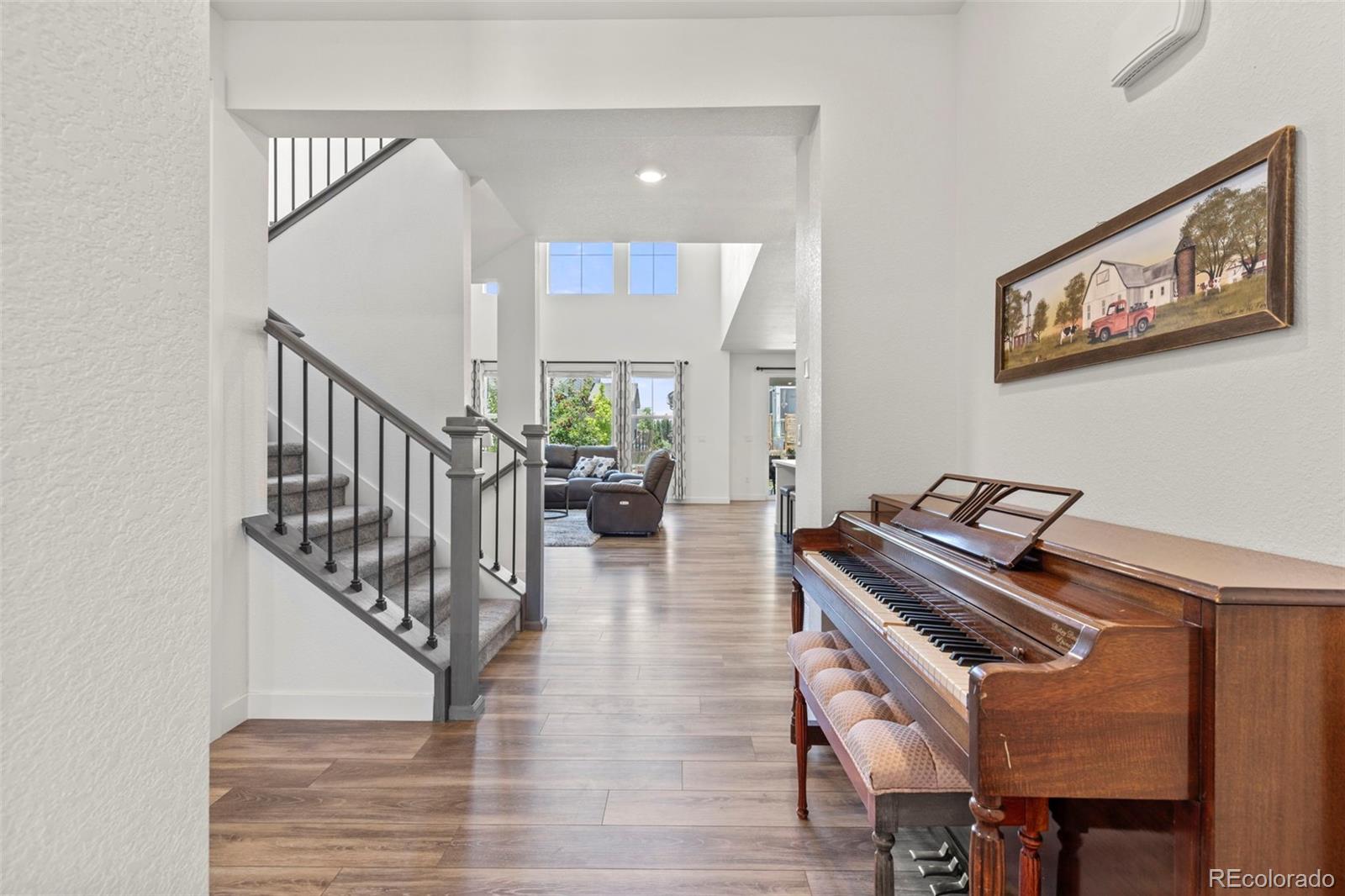 5067 Preserve Place Firestone, CO 80504 - Photo 16 of 50 a living room with furniture and a stairs