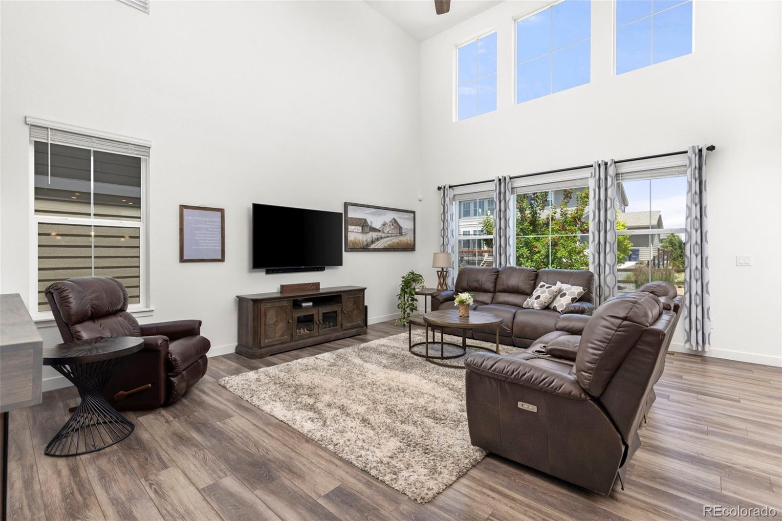 5067 Preserve Place Firestone, CO 80504 - Photo 17 of 50 a living room with furniture and a flat screen tv