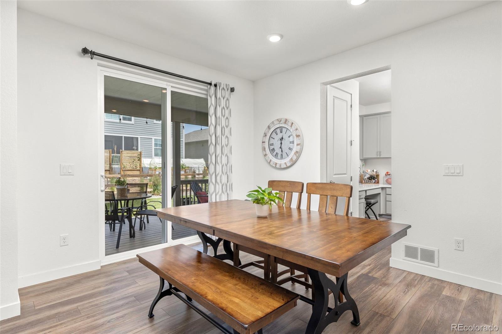 5067 Preserve Place Firestone, CO 80504 - Photo 24 of 50 a view of a dining room with furniture and wooden floor