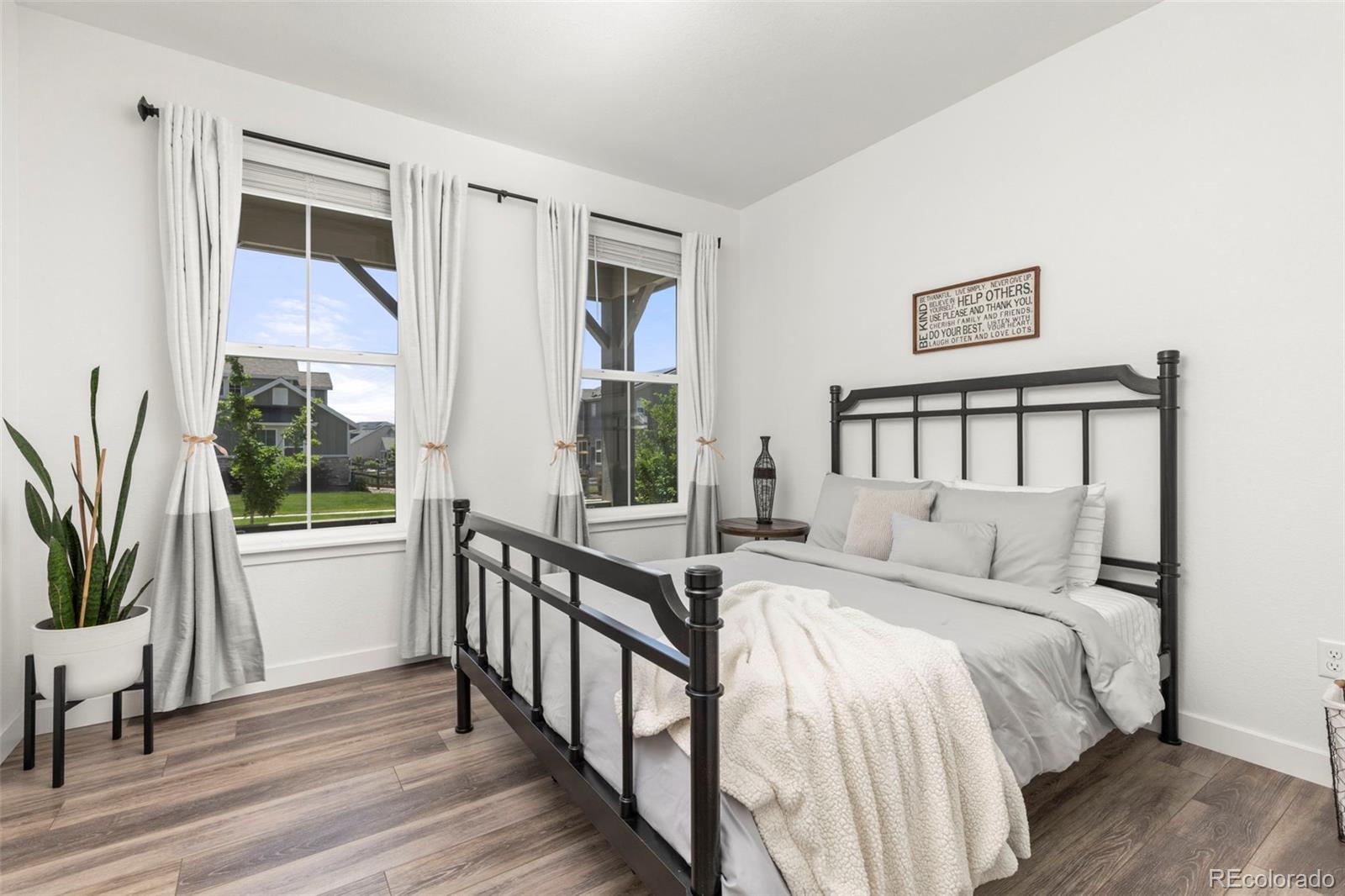 5067 Preserve Place Firestone, CO 80504 - Photo 26 of 50 a bedroom with a bed and a large window with outer view