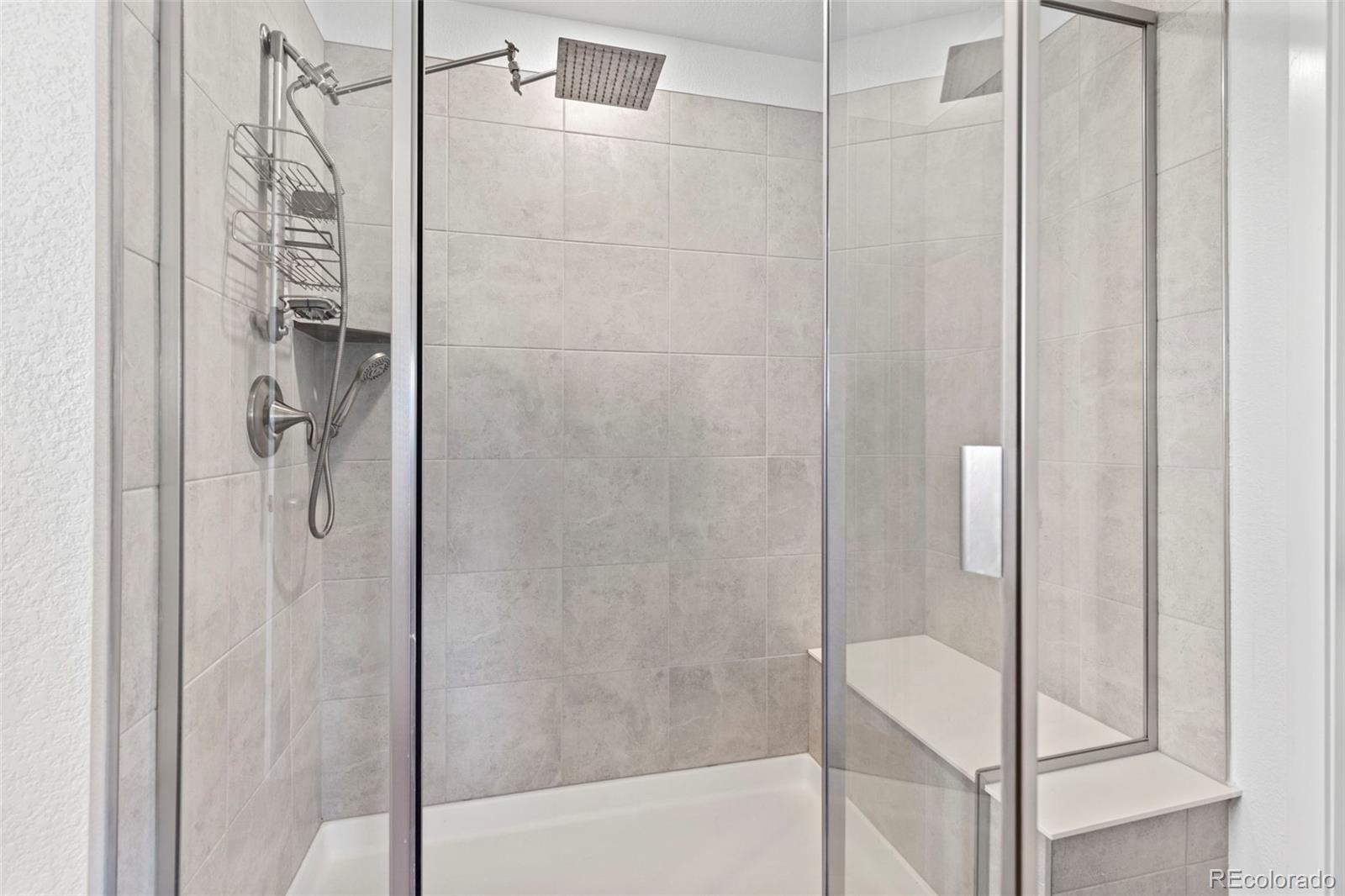 5067 Preserve Place Firestone, CO 80504 - Photo 31 of 50 a bathroom with a glass shower door